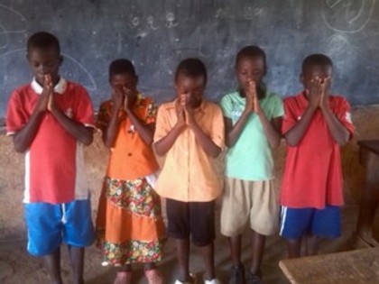 Classic children were praying during saturday club