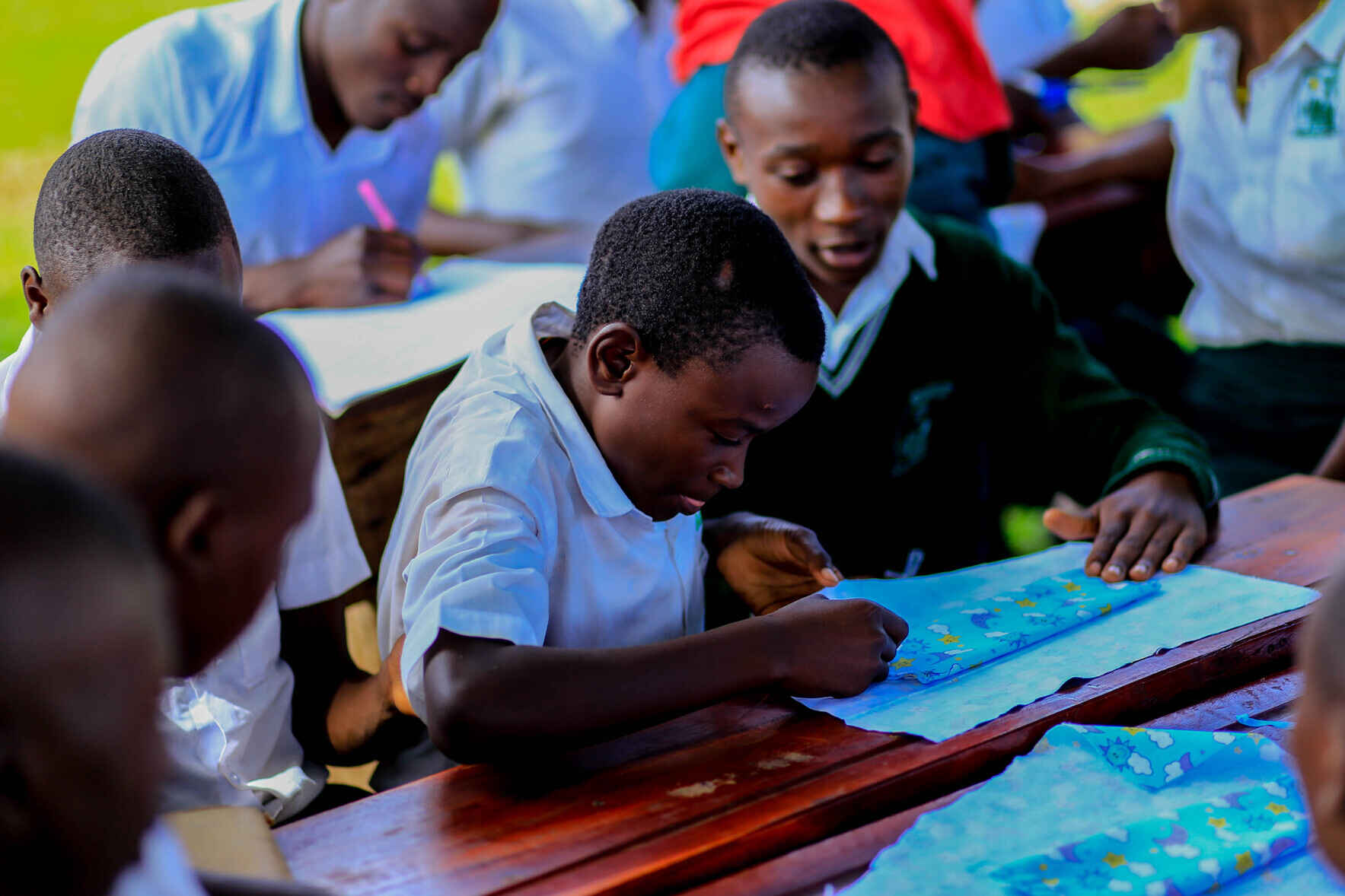 Help me provide 200 girls in Uganda with menstrual health education, training, and materials to make reusable pads. image