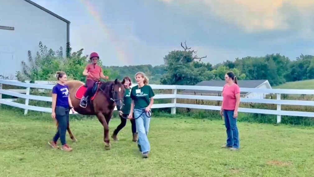 Nora loves rainbows and riding at Miracles! image
