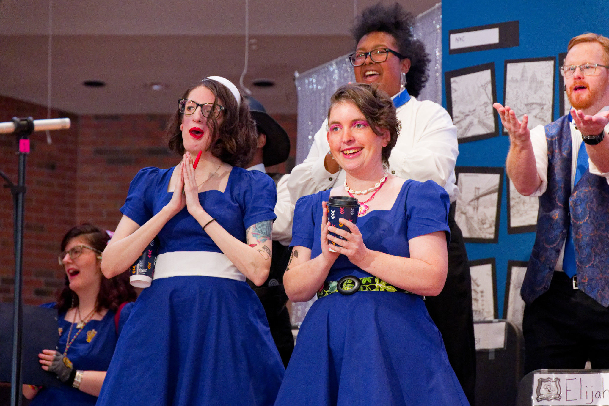 Christine A and Jessica Beggs play students at Empowered University in the All You Need is Love Cabaret - Spring 2025